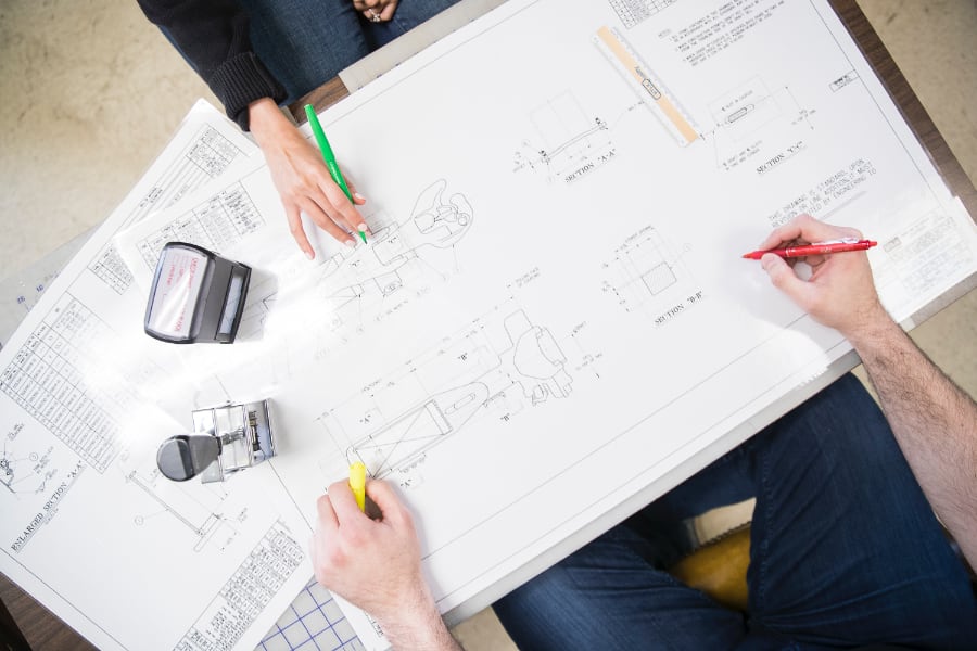 Rail-and-Leasing-Union-Tank-Car-Company-Planning Coworkers working on diagram plans together