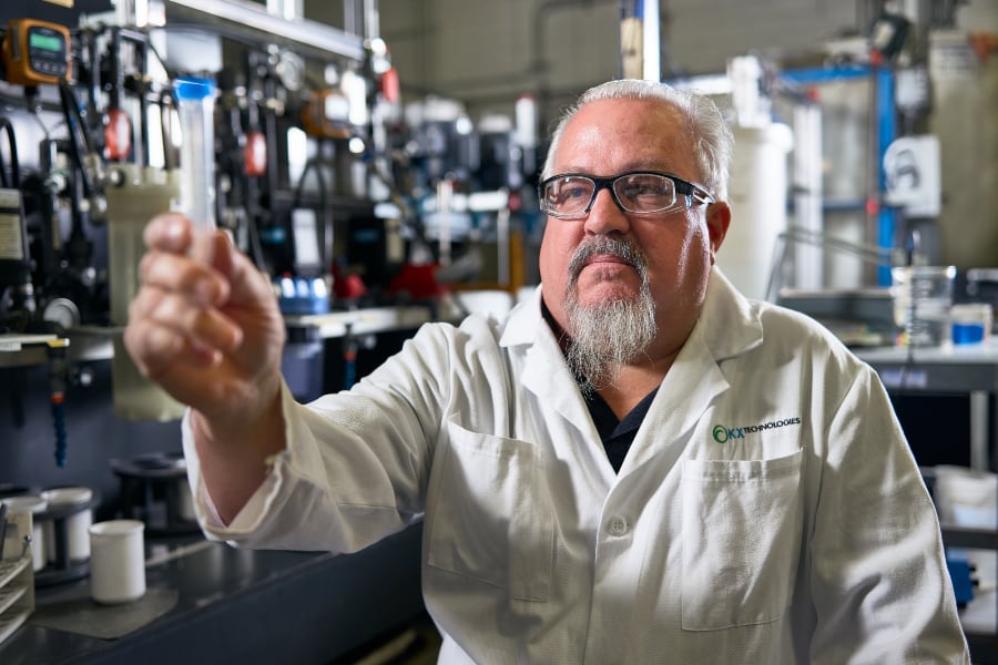 Water-KX-Technologies-LLC-KX-Tech Lab technician evaluating test tube