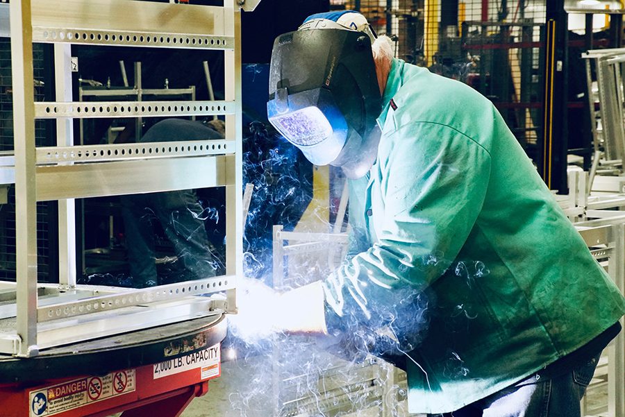 Employee at work in Retail Solutions facility. 