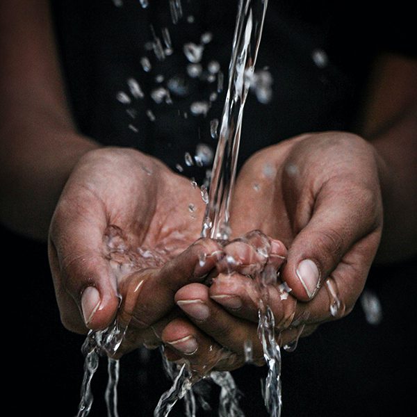 Water pouring through hands