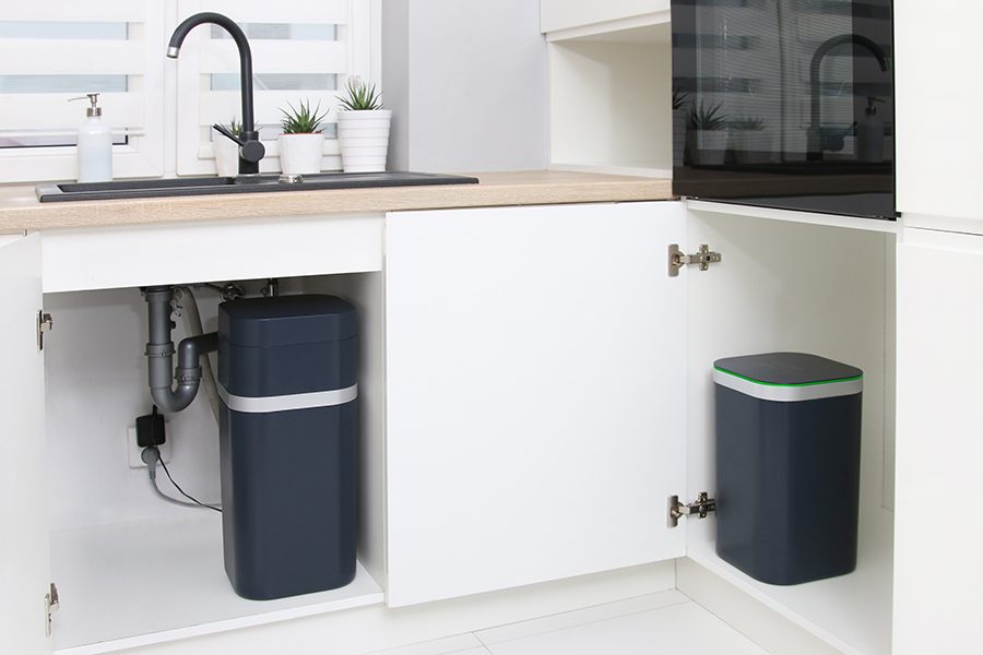 EcoWater Europe Duo 2.0 product being used under the sink and cabinet