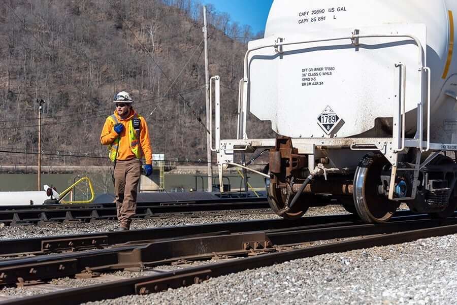 Employee at work on rail tracks Railserve Inc