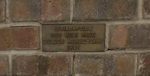 Commemorative plaque on the Indy 500 racetrack laid by Ray Harroun in 1961.