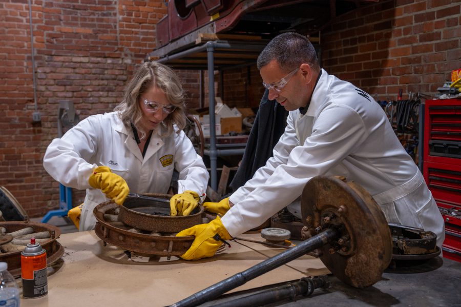 Two engineers building parts for the Wasp replica car